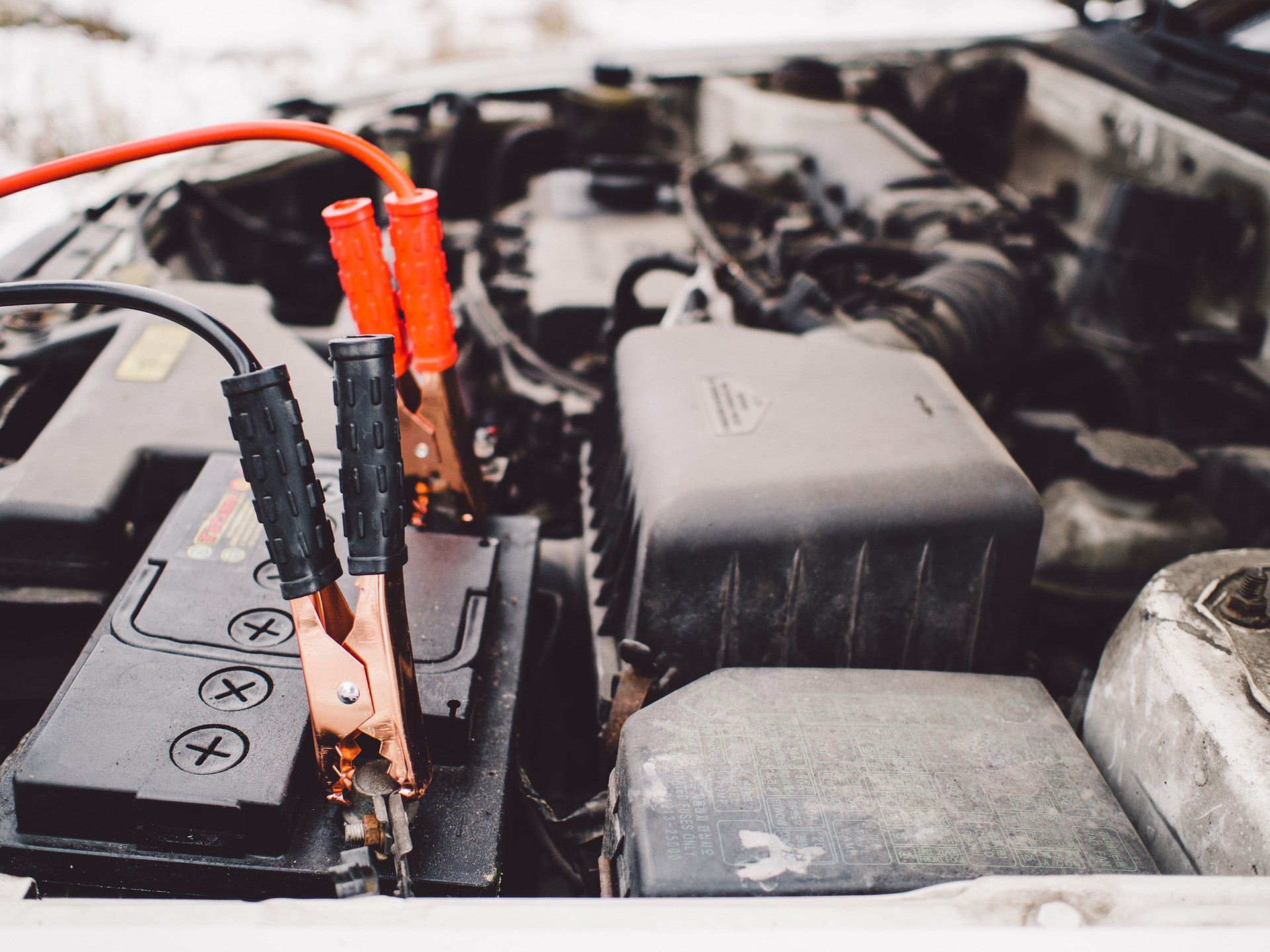 car batter, jumper cables, jumpstart